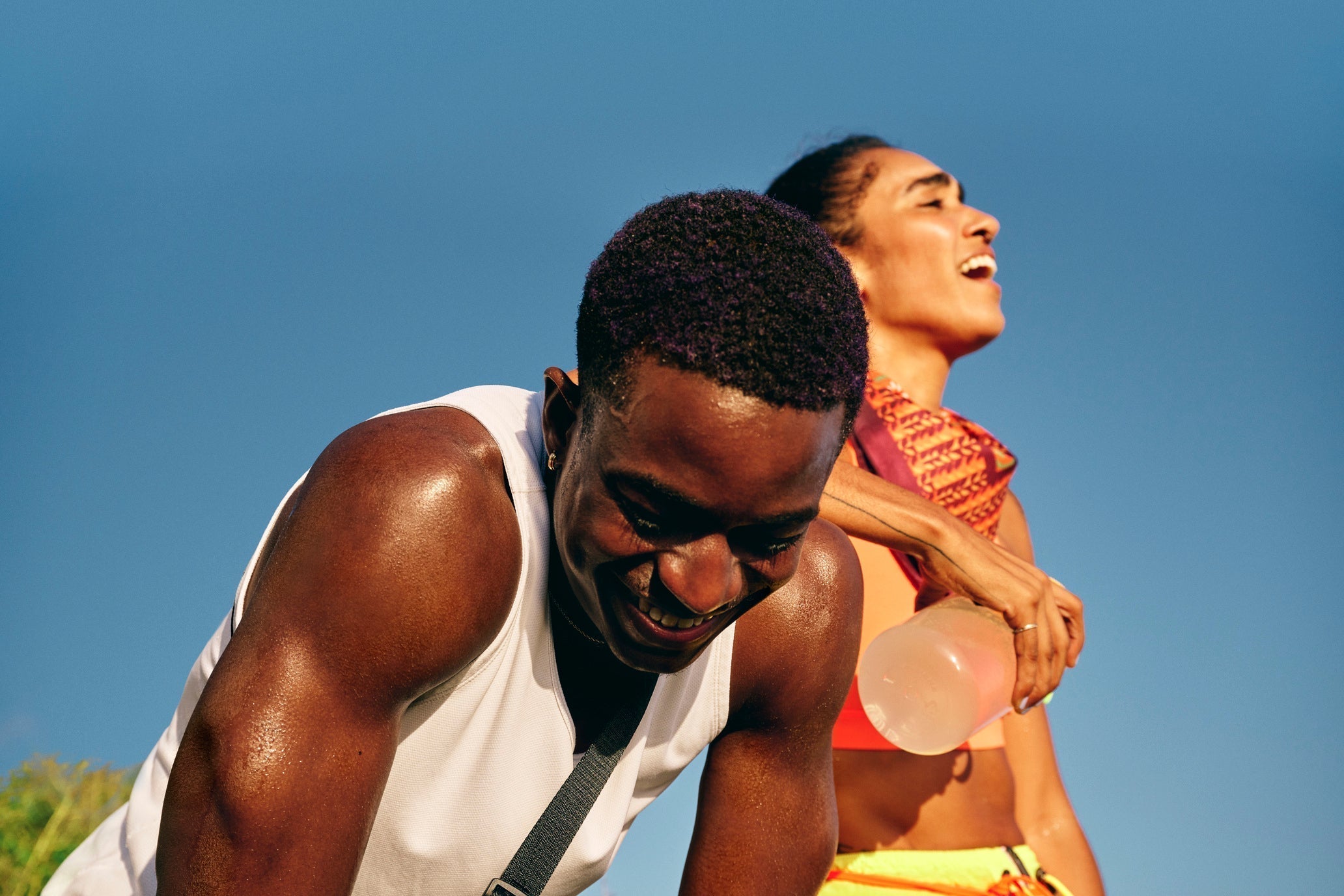 Two runner exhausted after running drinking electrolyte powder